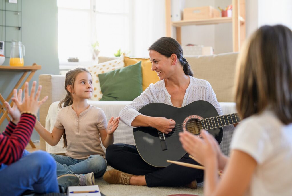 Mother & Children Playing Music